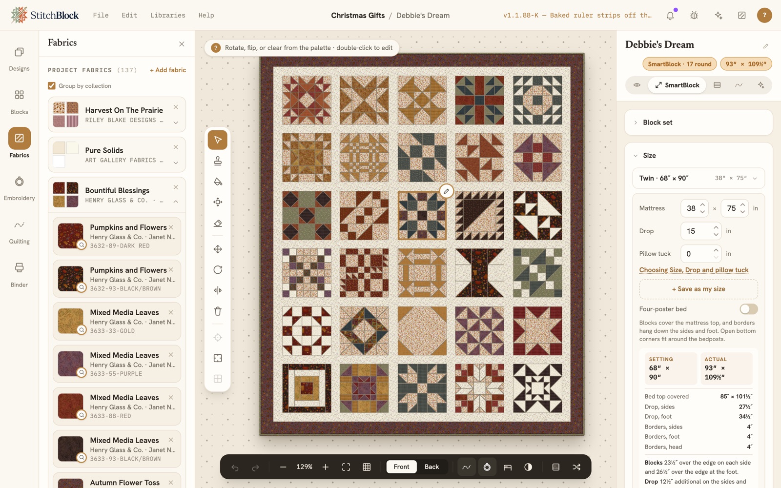 The StitchBlock worktable: a sampler in Henry Glass fabrics with a block selected, the Fabrics panel on the left, and the SmartBlock tab open on the right on the Size card, where the quilt is sized to a twin mattress with its drop